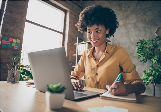 Whole Life woman working on her laptop