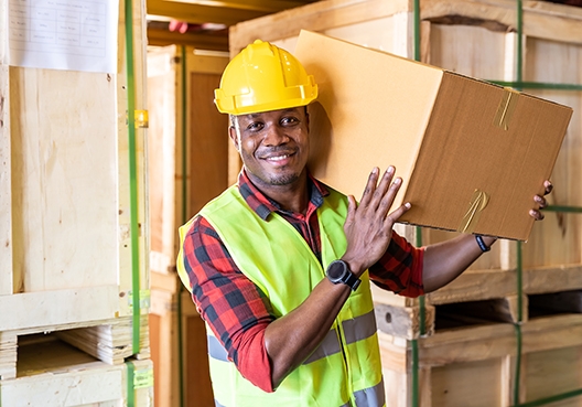 construction worker carrying a parcel