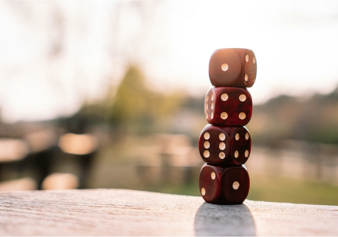 Red dice stacked on table on terrace