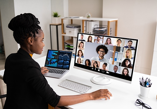 woman sitting at her desk in a zoom meeting